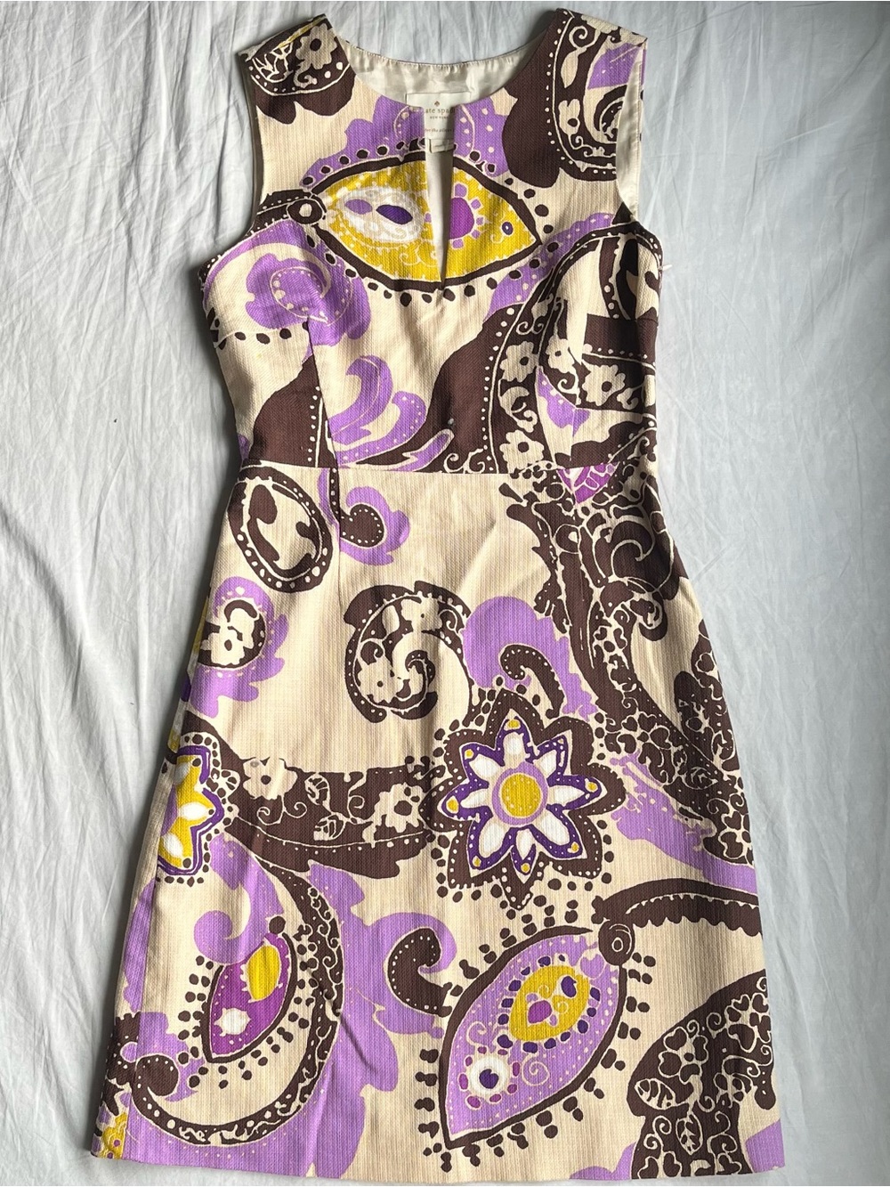 sleeveless cream dress with purple & brown floral paisley pattern